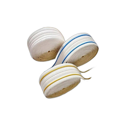 Rolls of white embossed self-adhesive strip with light blue, gold and black lines