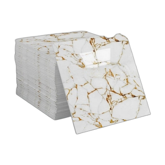 Pile of self-adhesive marble effect panels in white with golden veins and a panel leaning against it