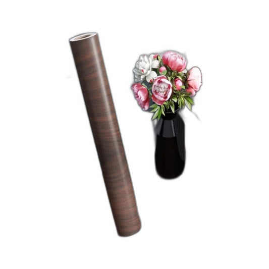 Roll of dark walnut effect self-adhesive vinyl beside a windowsill covered with the same vinyl
